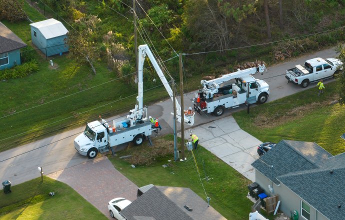 power & utility bucket truck servicing a power line